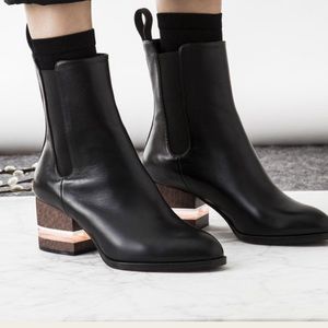 ISO DEAR FRANCES FLY LUCITE HEEL TAB BOOTIES